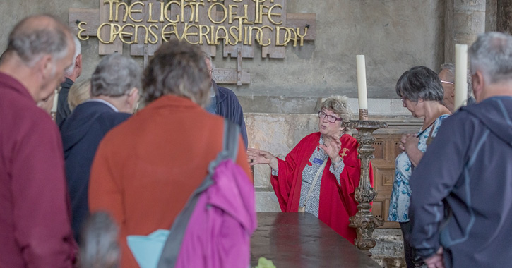 People enjoying a guided tour of Durham Cathedral